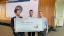 Jack, Meryll, Josh, holding the check from winning the competition Egal